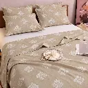 Beige Floral Bedding Still Life.webp